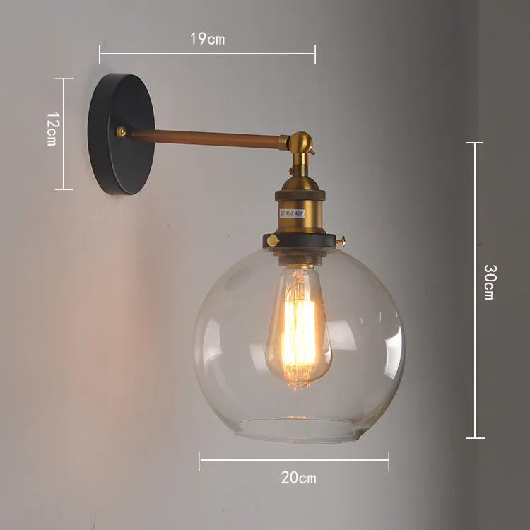 Retro-style 20cm round ball glass wall lamp with aluminium holder in amber, smoke grey, or transparent.