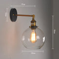 Retro-style 20cm round ball glass wall lamp with aluminium holder in amber, smoke grey, or transparent.