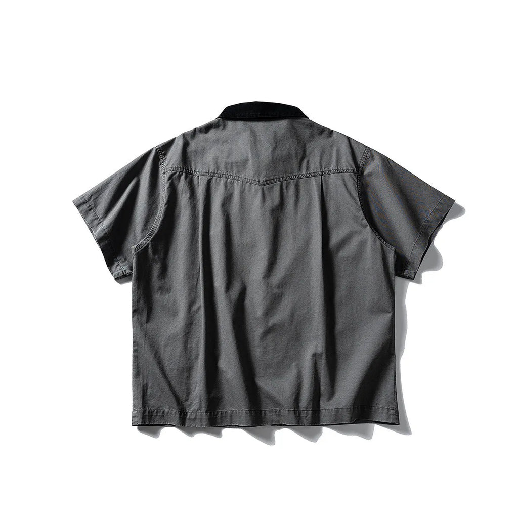 Short sleeve loose cotton overalls shirt in khaki colour on a hanger