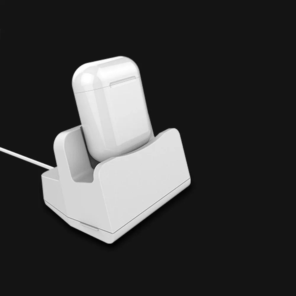 White headphone charging base with minimalist design on desk surface