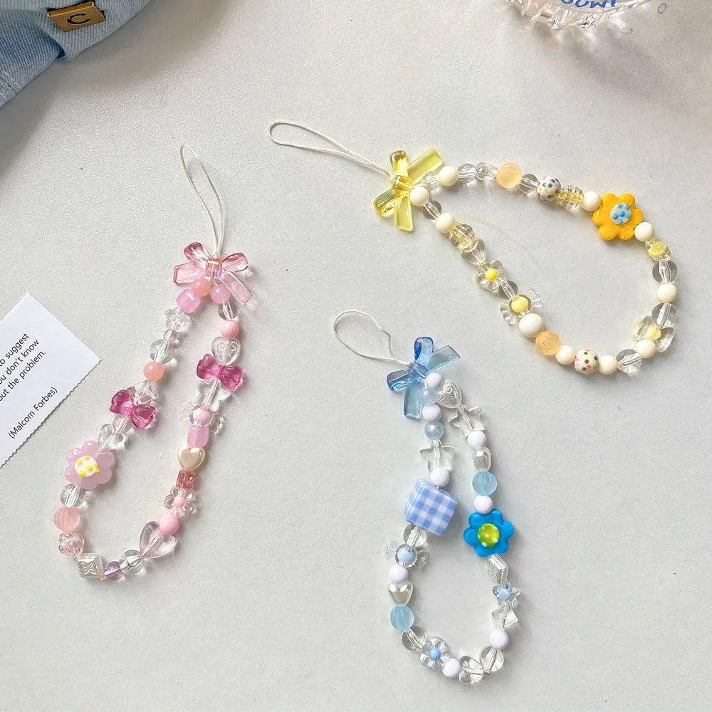 Colourful beaded floral phone lanyard in blue, pink, or yellow on a rope cord.