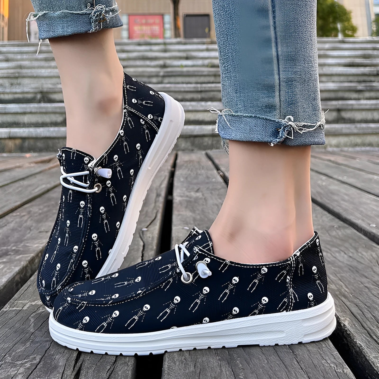 Women's black canvas low-top soft sole shoes on display, showing side view, plus size range 37-42