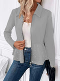 Women's black coat with beaded heavy-duty zipper and ruffled hem, loose fit, long sleeves.