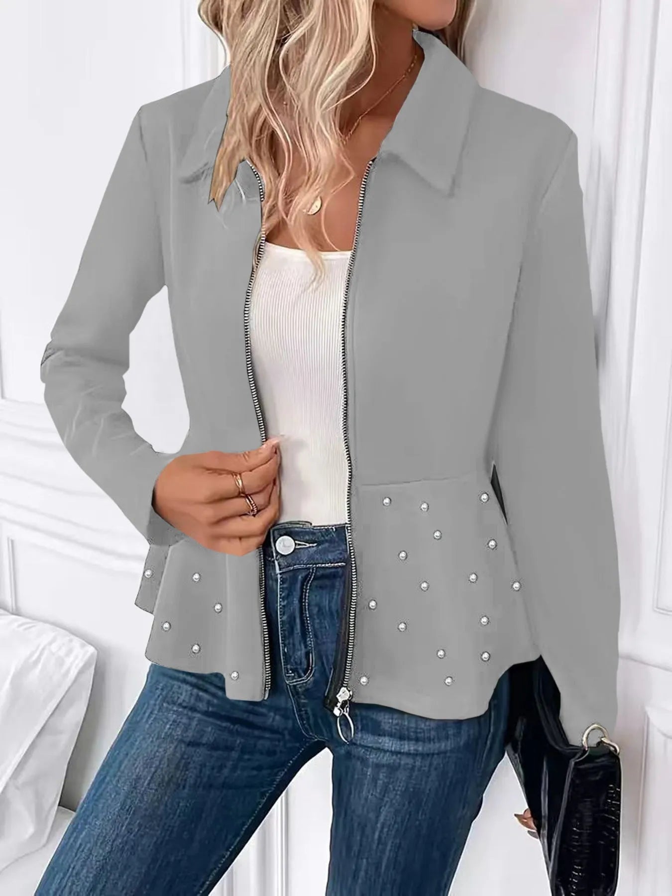 Women's black coat with beaded heavy-duty zipper and ruffled hem, loose fit, long sleeves.