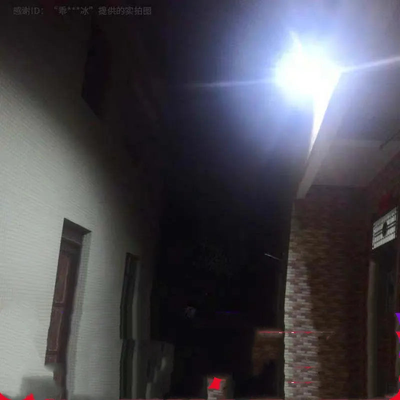 Black Cornucopia solar-powered LED flood light mounted on an outdoor wall with remote control.