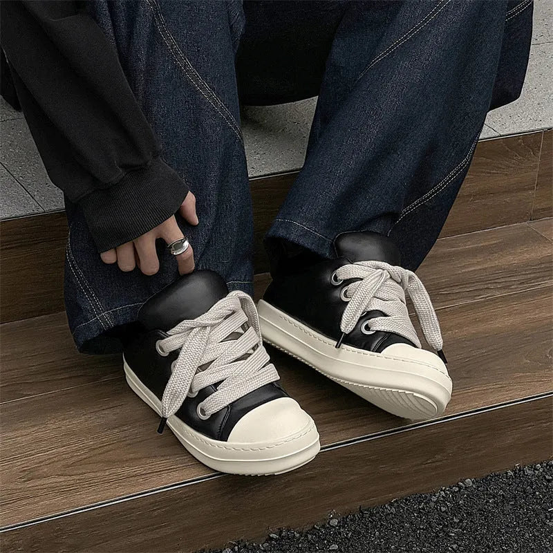 Black men's slip-on casual leather shoes with front lace-up and rubber soles