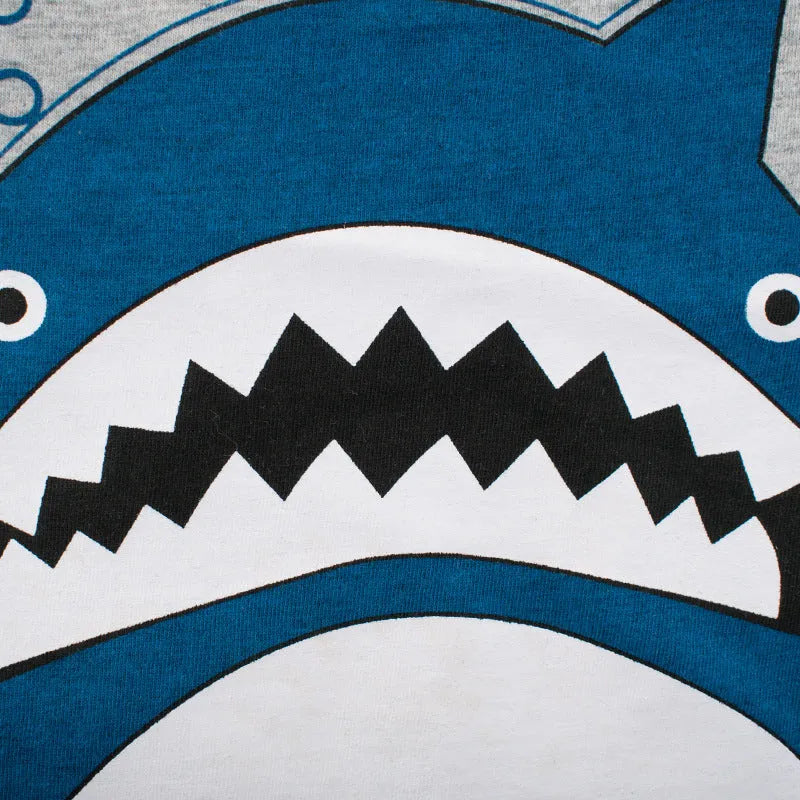 Grey cotton children's t-shirt laid flat, showing Asian size tags for 90cm, 100cm, 110cm, 120cm, 130cm, and 140cm lengths.