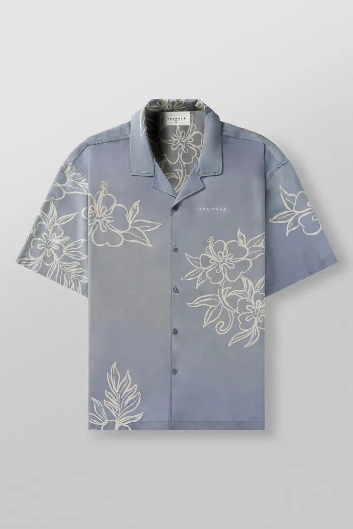 A man's loose-fitting, short-sleeve printed cardigan in a light colour for summer.