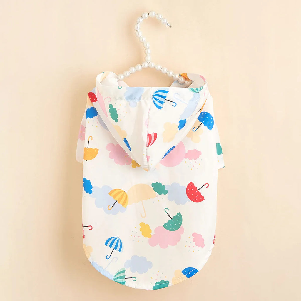 Colourful cartoon umbrella pattern dog or cat raincoat made from polyester fabric.