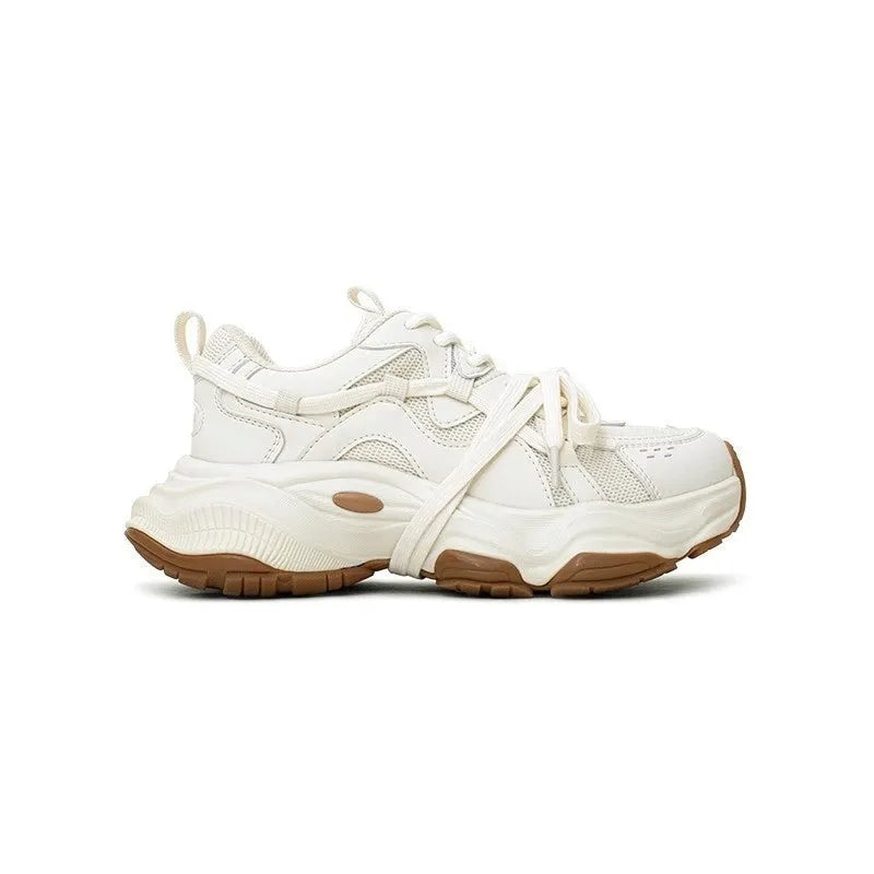 Milky white women's platform running sneaker with microfiber upper and front laces.