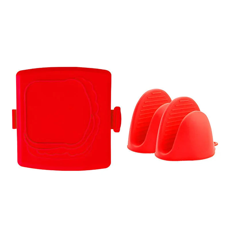 Red silicone baking tray and matching heat-resistant gloves set on kitchen counter