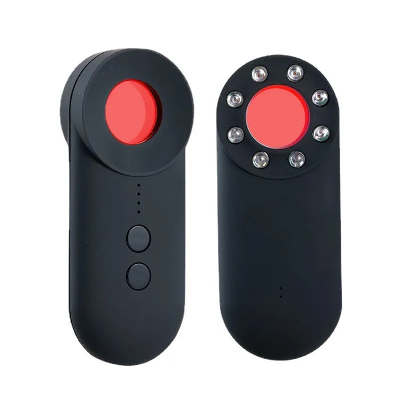 Black portable anti-car GPS and wifi signal detector with a USB cable on a table.