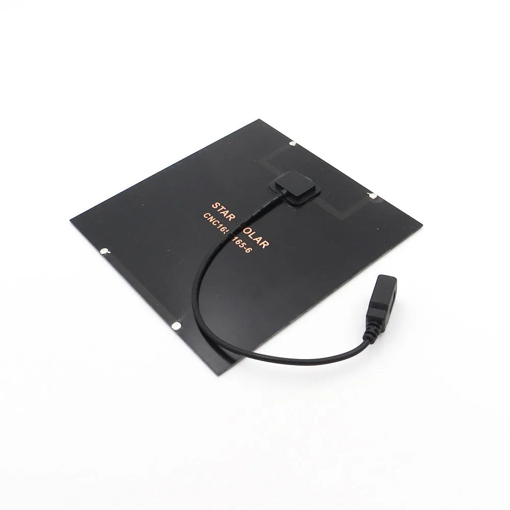 Portable solar panel unit with a small fan and a USB charging port for mobile phones.