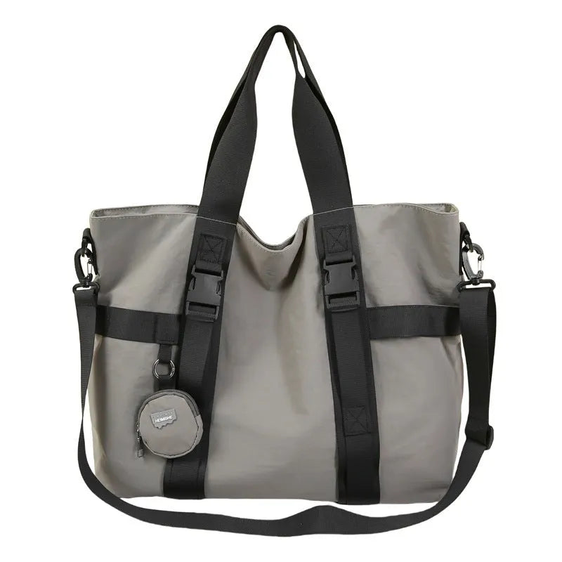 Men's large capacity shoulder travel bag in black colour with organisational compartments