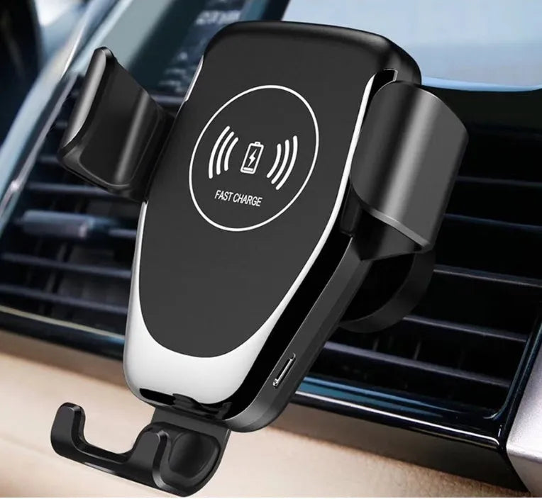 Black car wireless phone charger mounted on ventilation vent with iPhone securely clamped