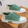 Men's low-top casual canvas shoes in blue with round toe and lace-up front for skateboarding