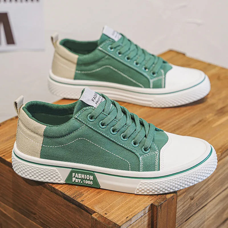Men's low-top casual canvas shoes in blue with round toe and lace-up front for skateboarding