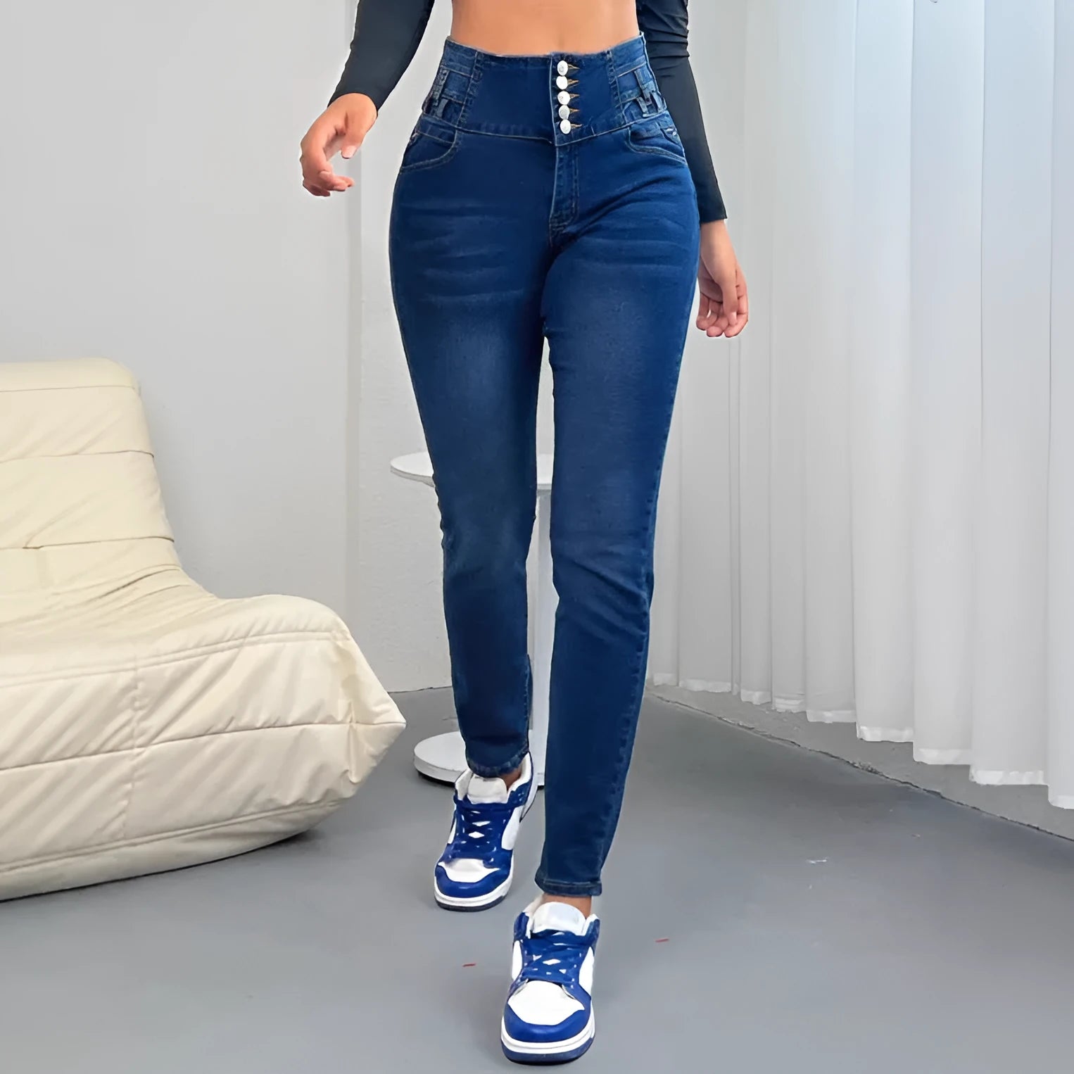 Dark blue women's denim trousers with a breasted front panel and straight leg.