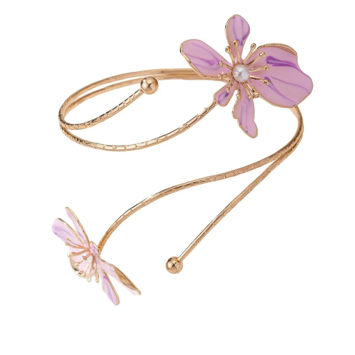 Close-up of a polished pink alloy armband with a hollow geometric pattern, shown on a wrist.