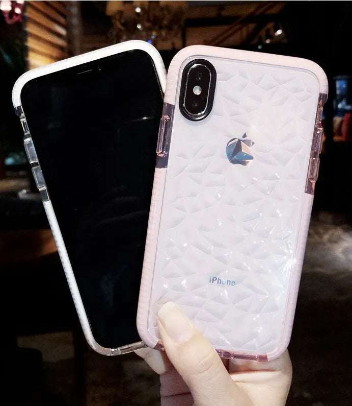 Striped pink and white TPU back cover case for iPhone on a table.