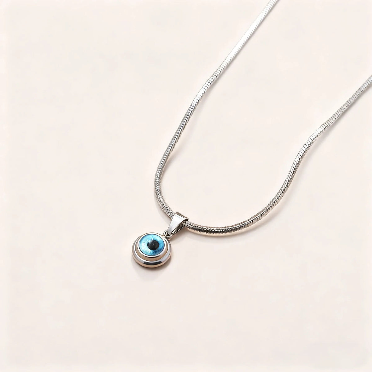 Angel Eyes titanium steel necklace with gold-plated eye pendant on 45.5cm snake bone chain