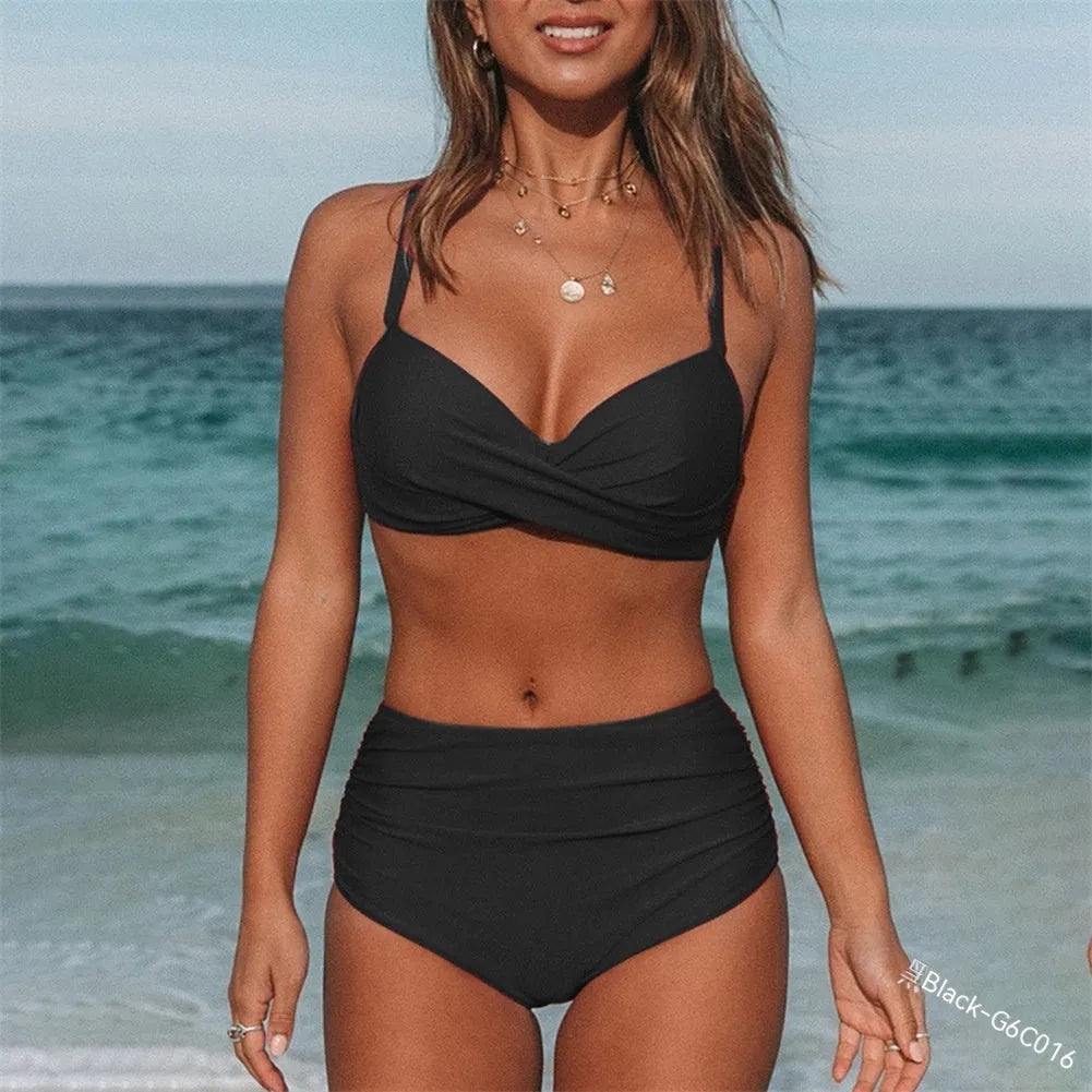 Women's solid colour cross strap bikini swimsuit on a hanger, showing front design.