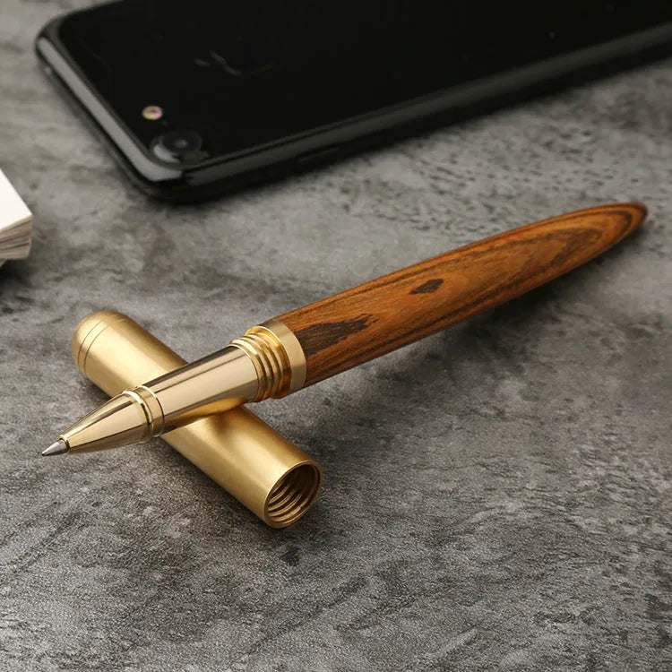 Brass and sandalwood signature pen showing wood grain and metal details at 14cm length