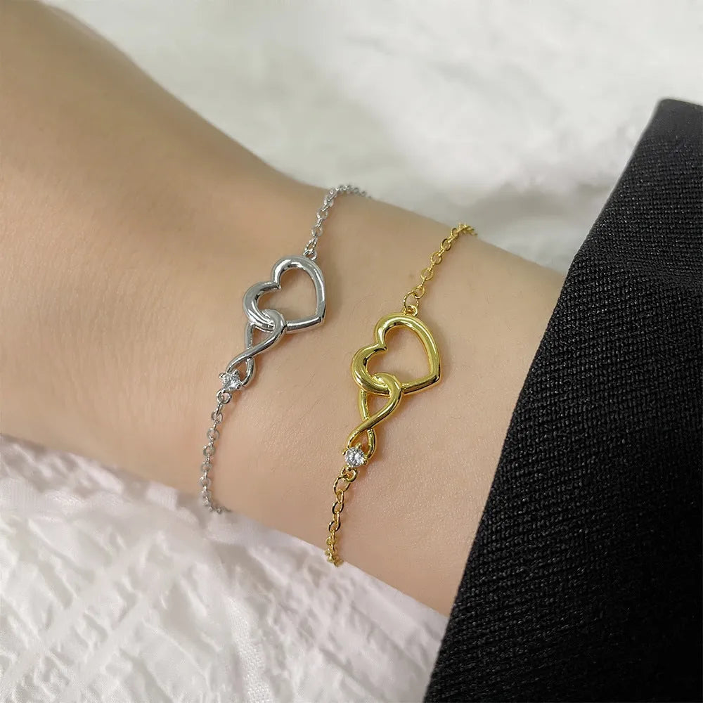 Heart-shape copper bracelet with clear 3A zirconia stone on adjustable chain in platinum finish