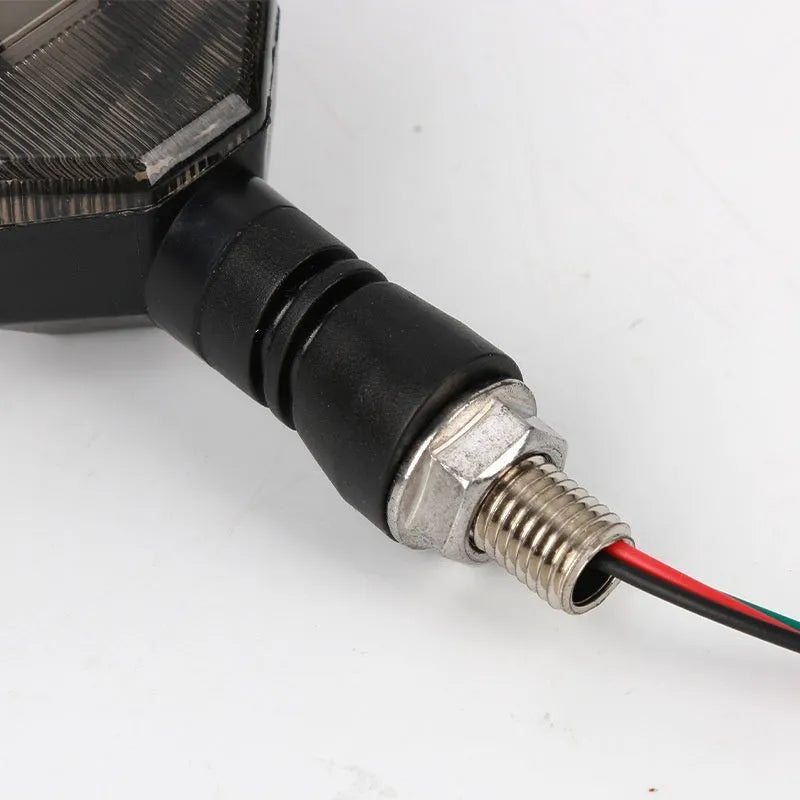 Arrow-shaped LED motorcycle turn signal lamp in ABS plastic housing for 12v universal vehicle fit.