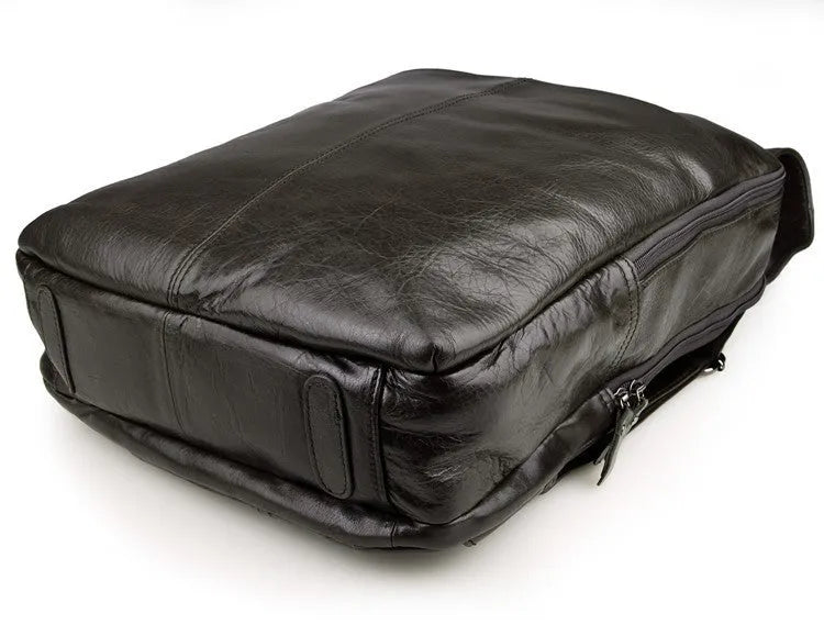 Top layer leather computer backpack in brown colour with zip closure designed to fit a 15 inch laptop