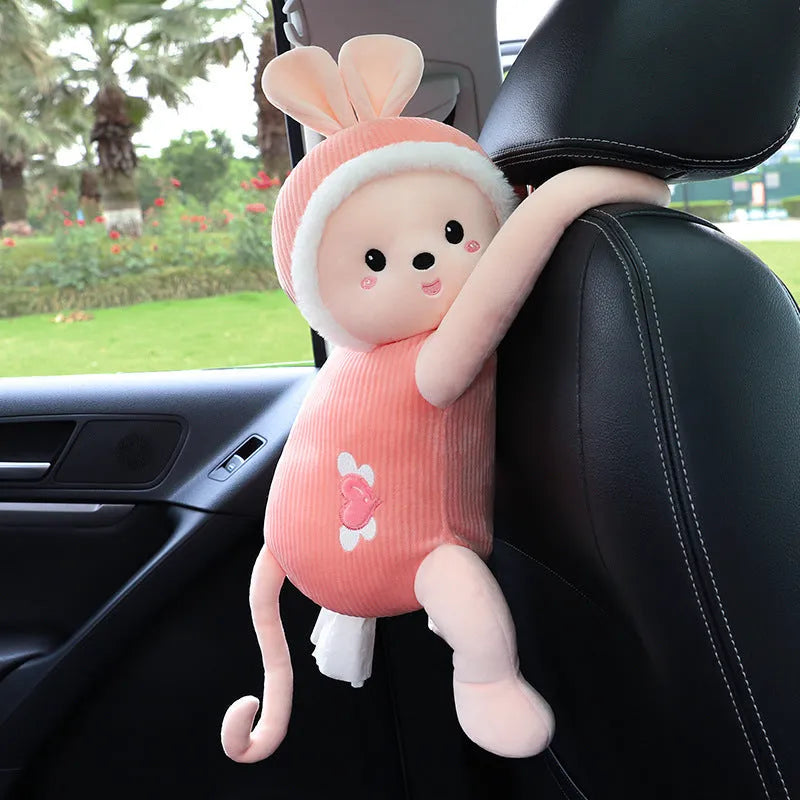 Soft plush car headrest tissue box holder in a cute animal character style.