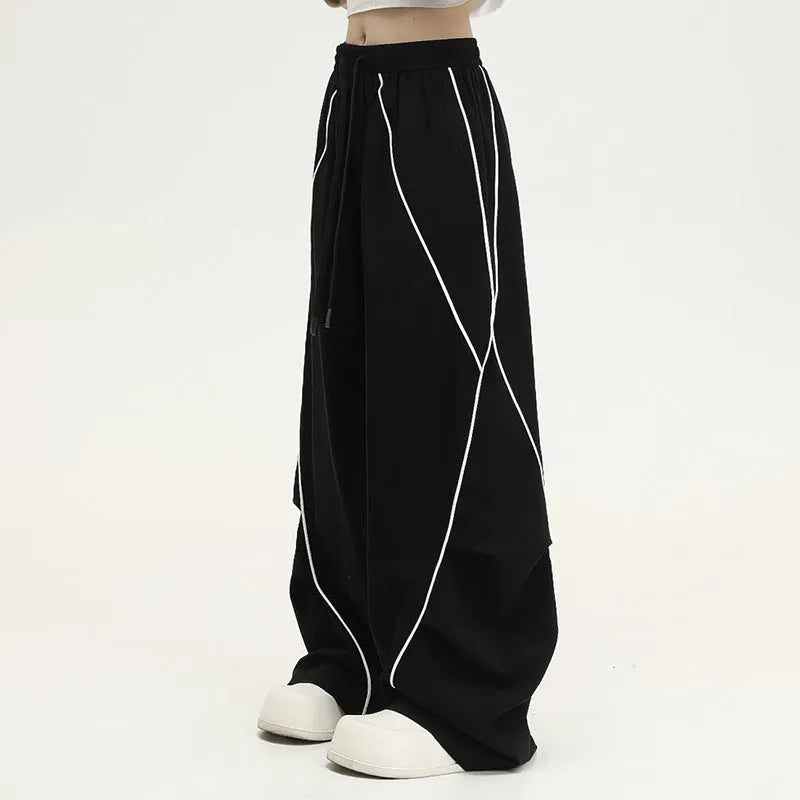 Black striped hip hop trousers with pleated wide-leg design for dance and casual wear