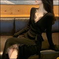 Black slim-fit women's formal skirt with a princess line silhouette on a hanger.
