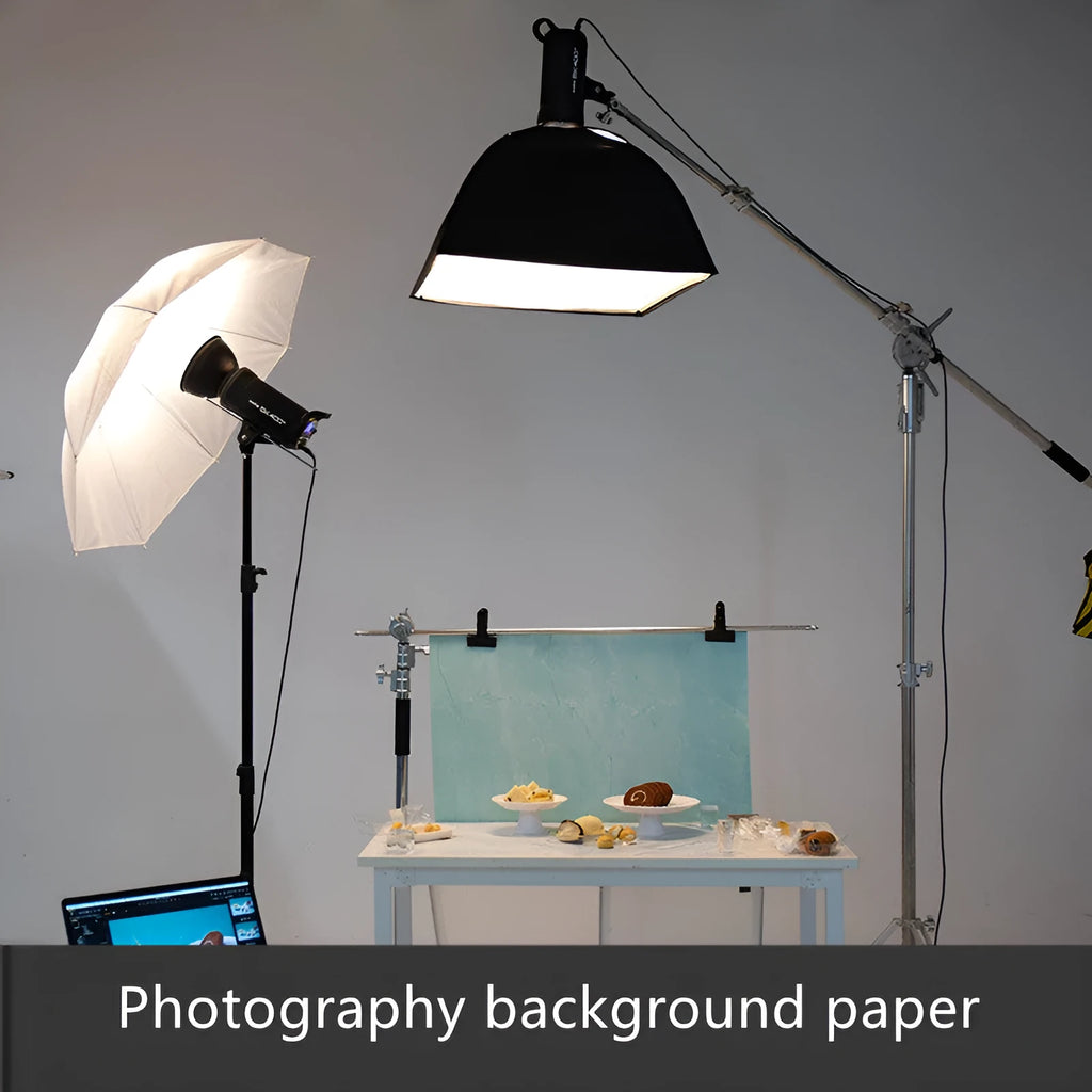 A double-sided marble texture photography background board on a table, showing two different pattern styles.