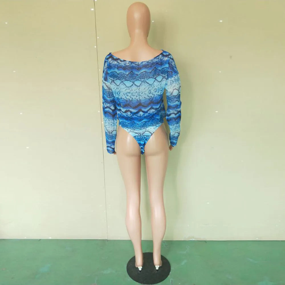 Women's purple snakeskin floral print long-sleeve swimsuit top and matching bikini bottoms.