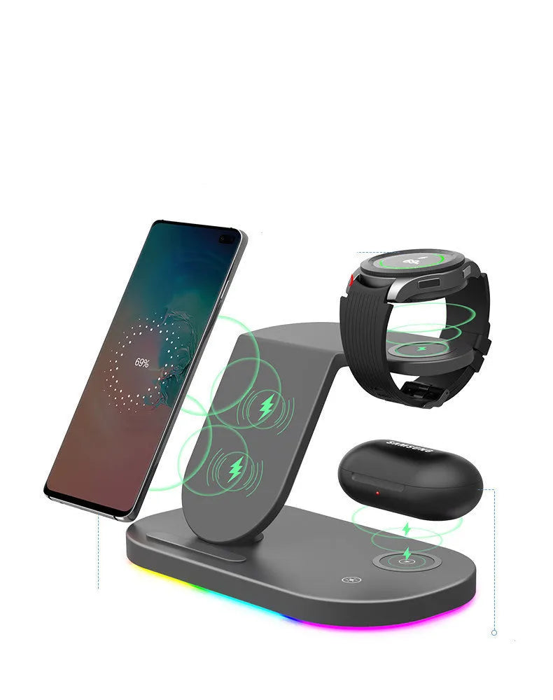 White three-in-one wireless charging stand holding an iPhone, an Apple Watch, and AirPods case.