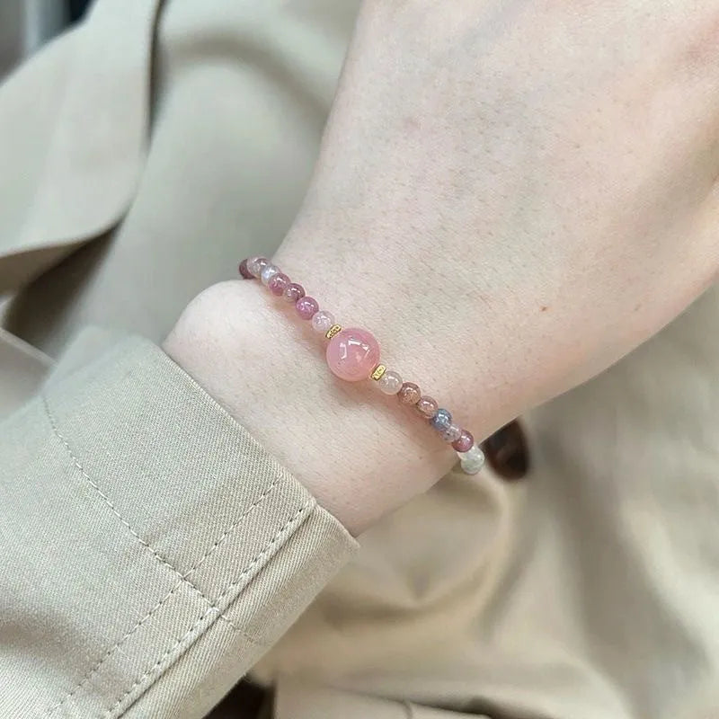 Women's pink crystal and electroplated alloy bracelet with geometric shapes in one of eight colour options.