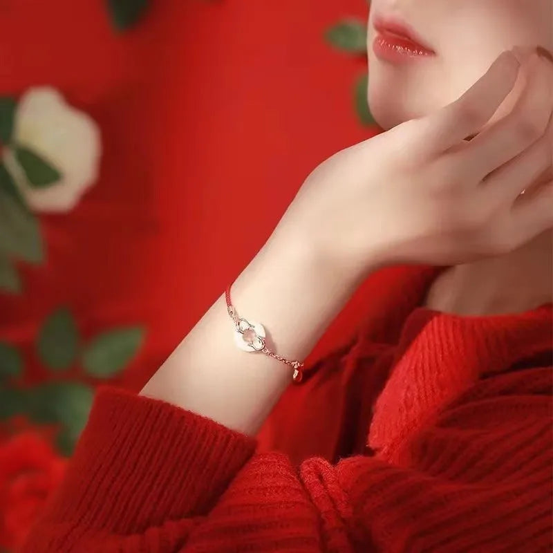 Women's festive koi bracelet with mixed materials, fishtail elements, and peace buckle closure