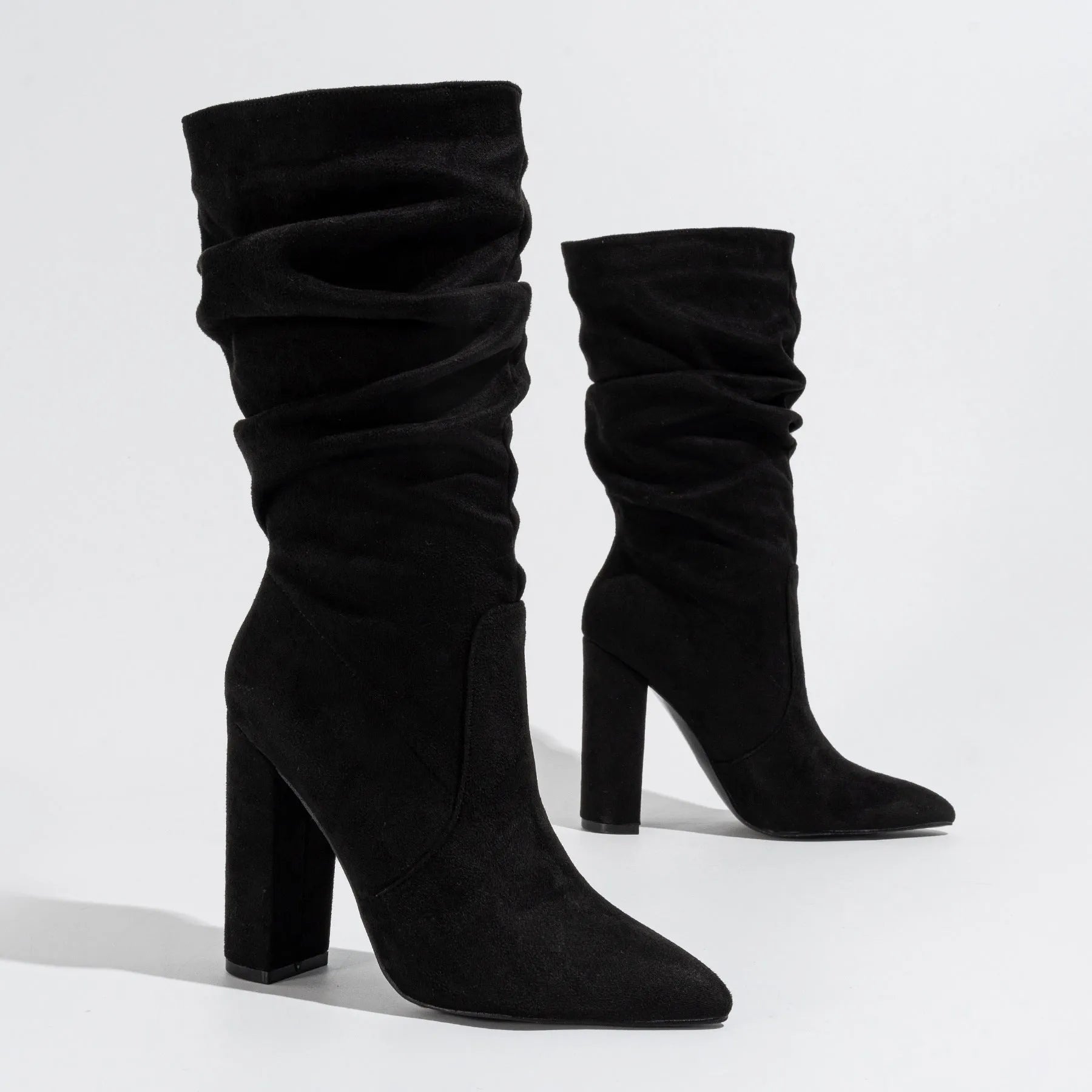 Women's black suede chunky heel pointed-toe boots with a high shaft