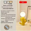 Green cactus button desk lamp with three-colour accents on a bedside table in a child's room