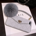 Soft plush hairball phone case with a grid pattern for iPhone, shown in dark green.