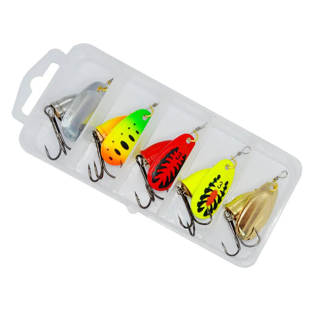 R composite rotating sequins and copper bell metal fishing lure in seven colour options on a blue background.