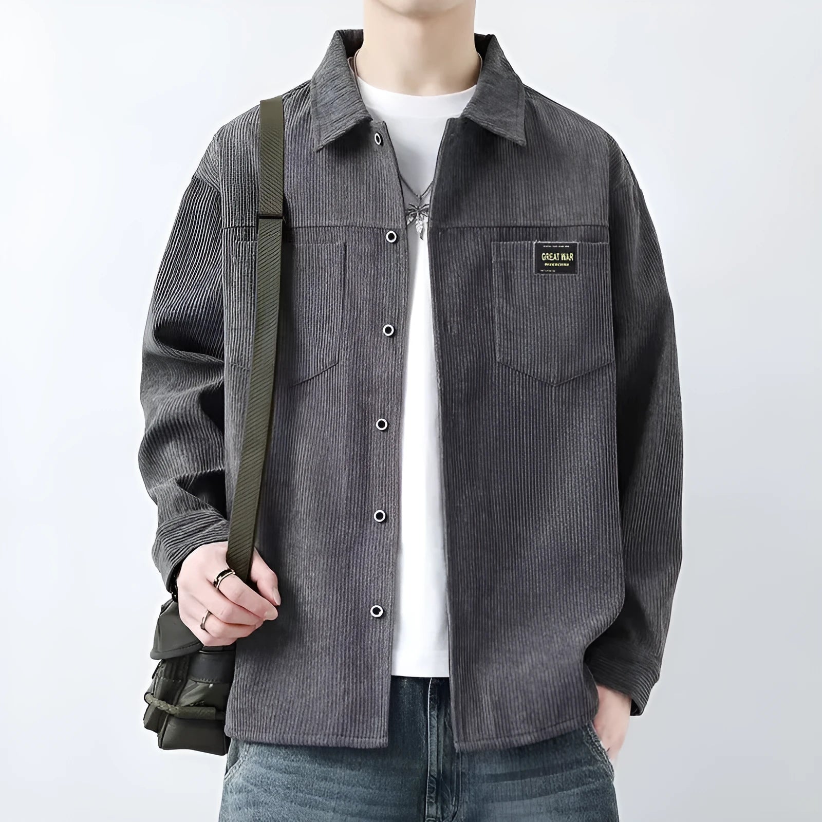 A man's long-sleeved corduroy cardigan jacket available in black, grey, khaki, and orange.