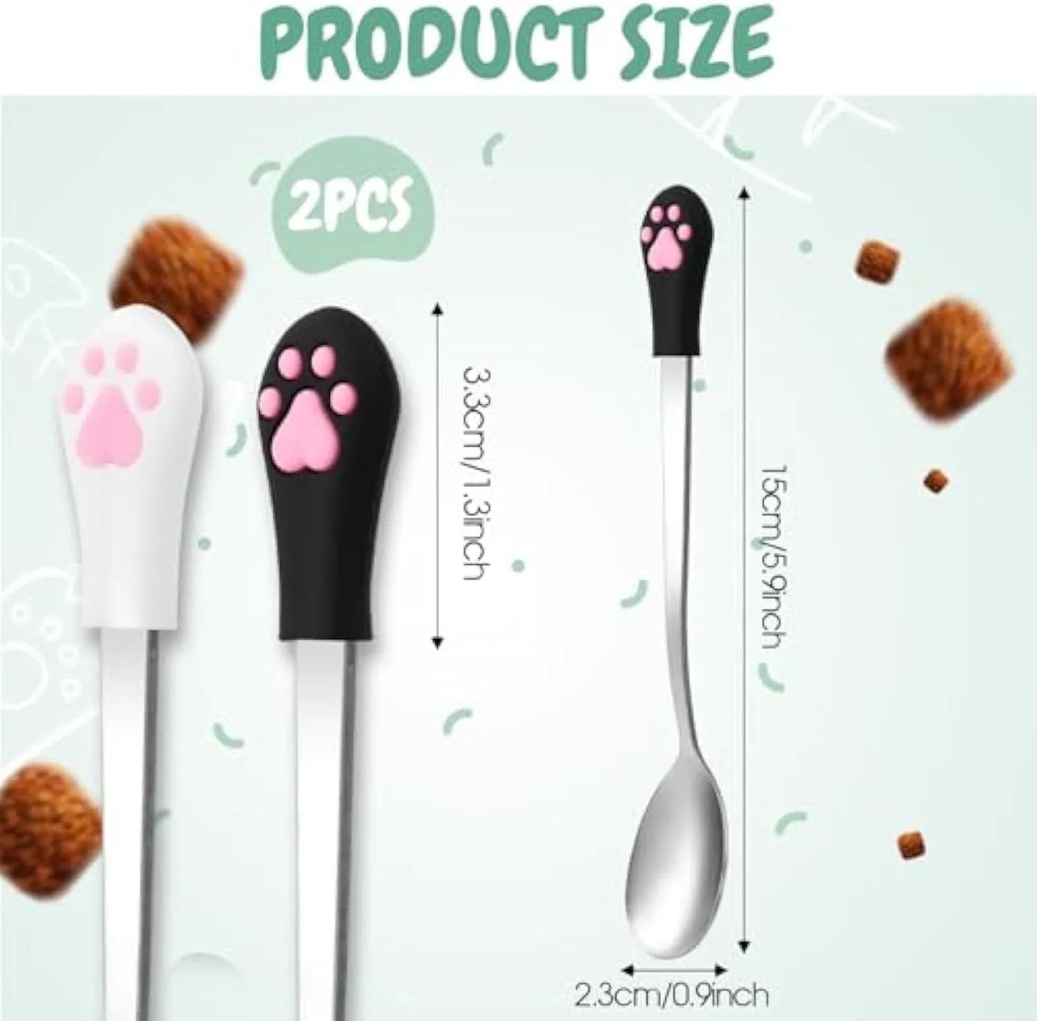 White and black stainless steel pet food spoons with cat paw print design and silicone handles.