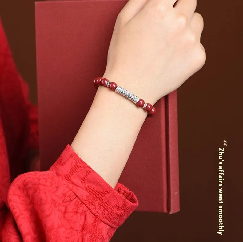 Handmade cinnabar bracelet with purple gold sand beads in a unisex national style design.