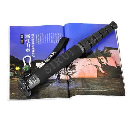 Black carbon fibre telescopic camera monopod extended to maximum height