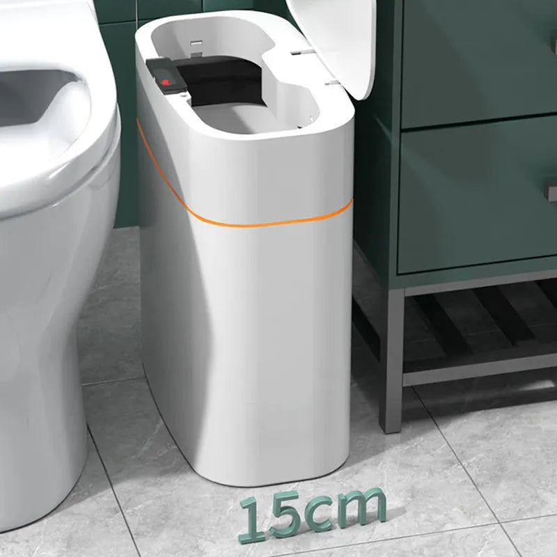 White smart induction trash can with automatic opening lid, shown in a kitchen setting.