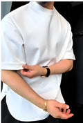 Men's white buttoned round hem t-shirt laid flat, showing crew neck and distinctive button detail on the curved hem.