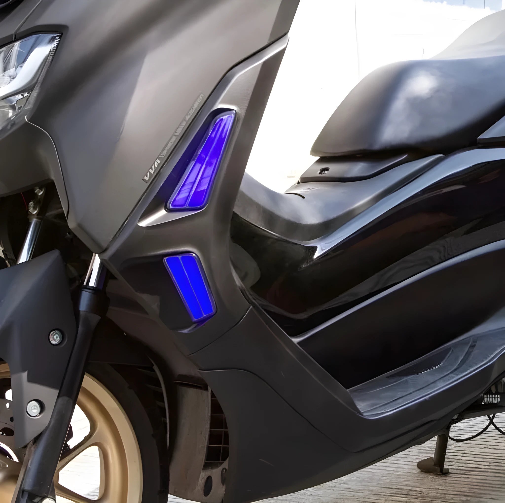 Pair of LED turn signal steering lights mounted on a Yamaha NMAX155 motorcycle handlebar, showing White/Yellow colour option.