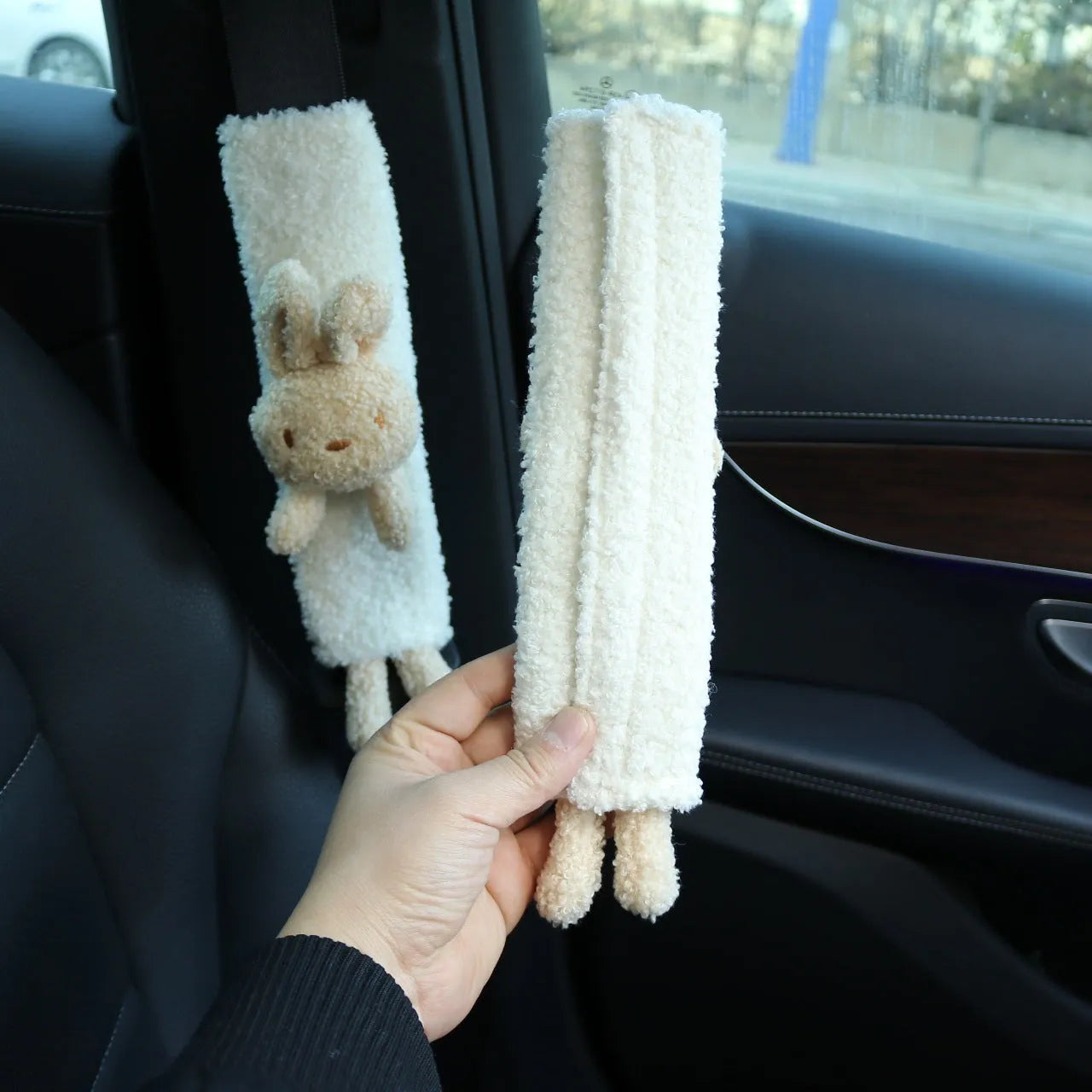 Cartoon plush lamb wool seat belt shoulder protector cover in Bear design on a car seat.